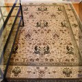 DR05. Ivory ground Persian style rug.  Approx. 6' x 9' 